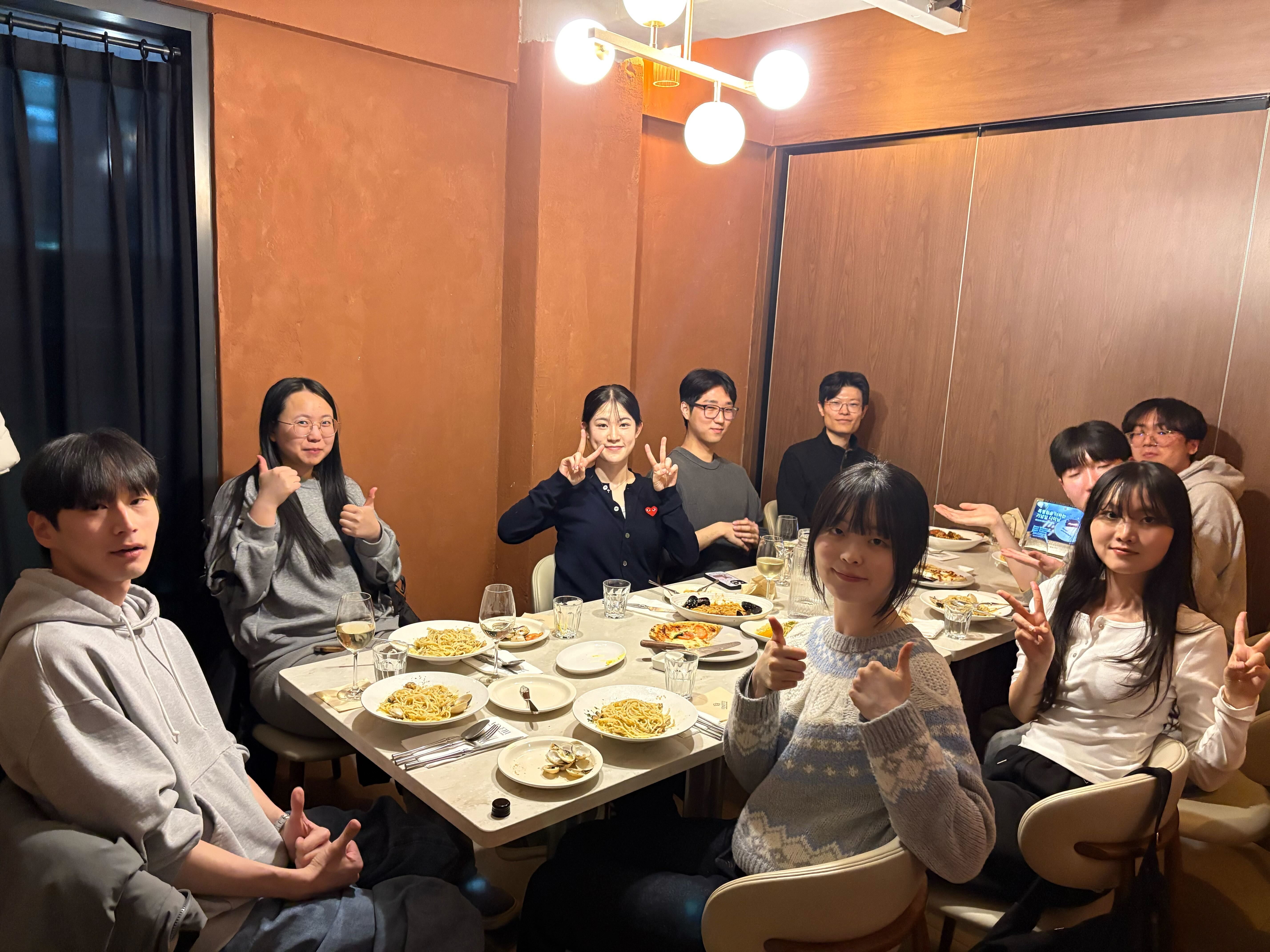 LILAB members gathered around a table at the lab's first team dinner